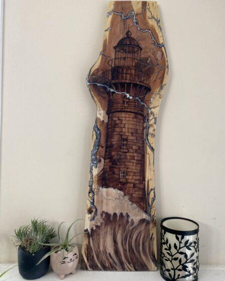 A lighthouse and fractals burned on wood