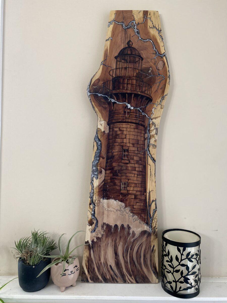A lighthouse and fractals burned on wood