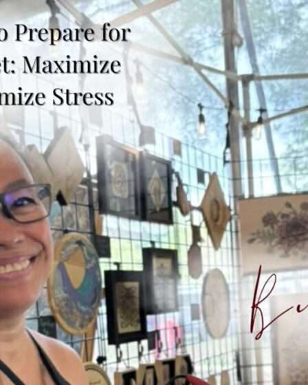 “Artist setting up a wooden art display booth at a local market.”